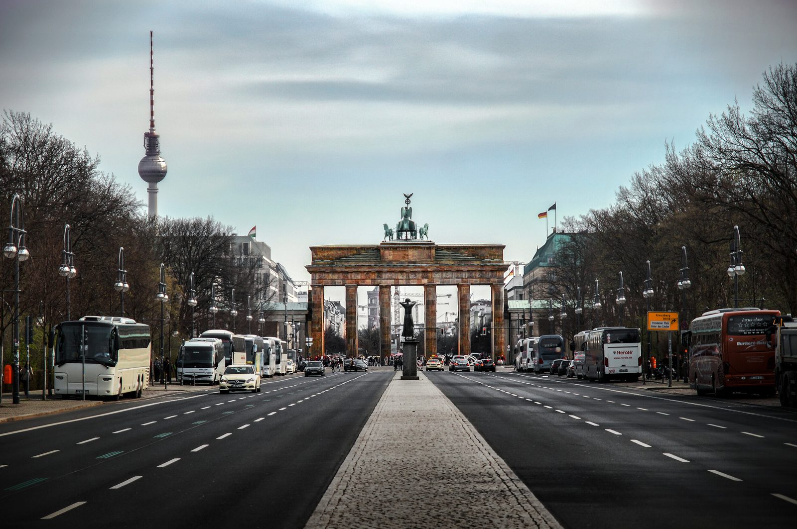 The Brandenburg Gate seen along an empty Berlin street
